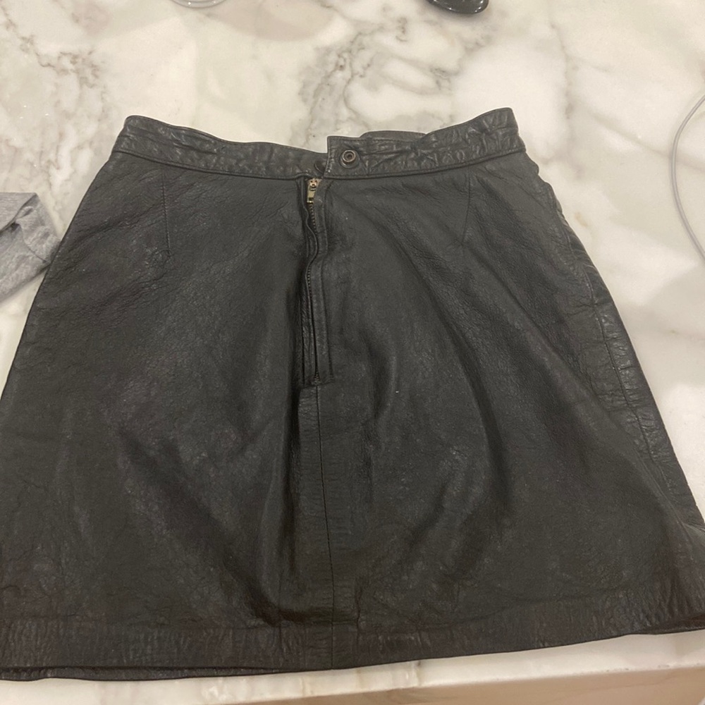 Real vintage leather skirt. Brand unknown. There is no tag.